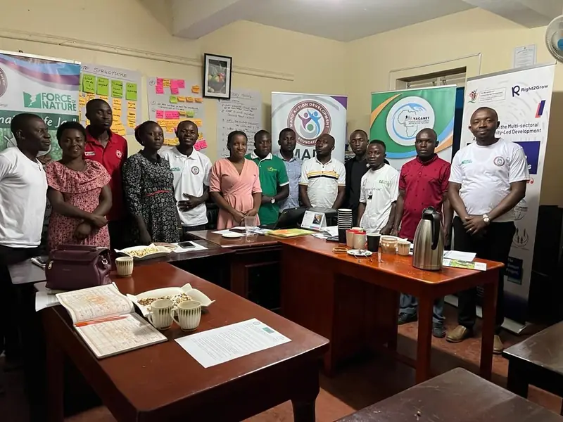 Climate Café participants stand together for a group photo in the office