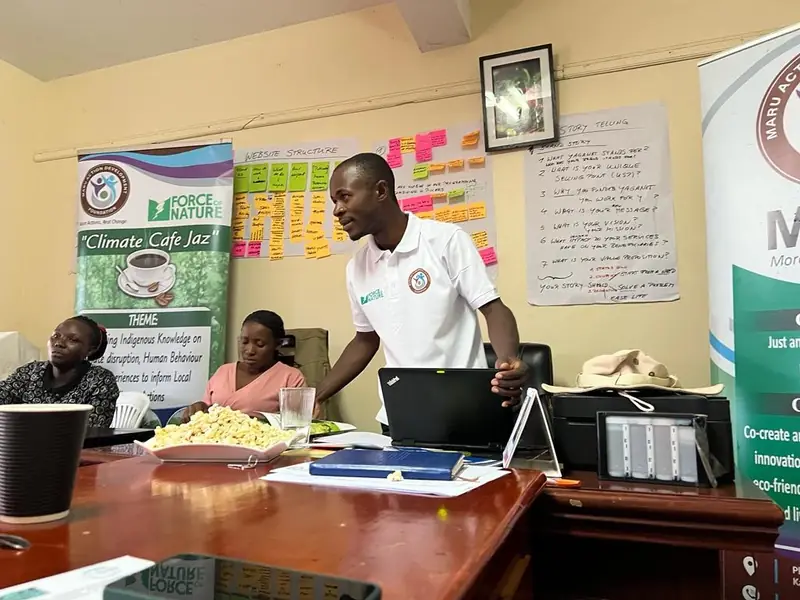 A facilitator speaks during a Climate Café session in the Maru Foundation office