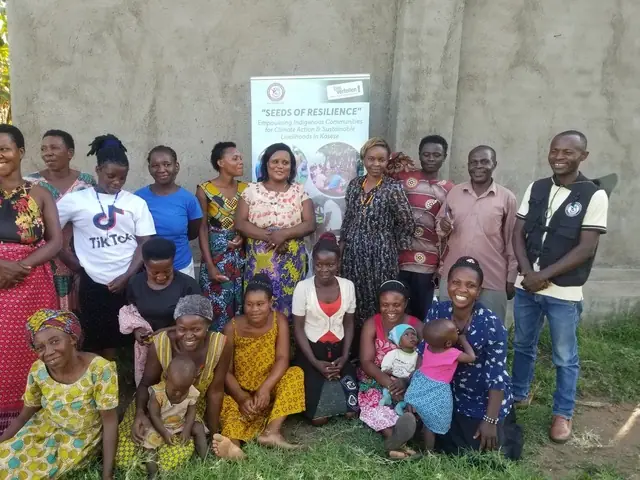 Seeds of Resilience participants stand together for a group photo beside the project banner