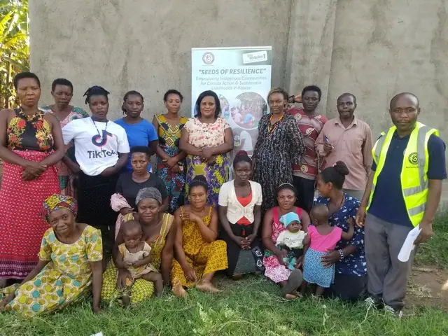 Women, children and staff pose together at a Seeds of Resilience training